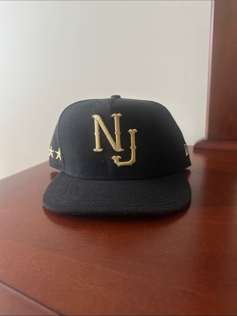 New Era Black and Gold NJ Embroidered Snapback Hat